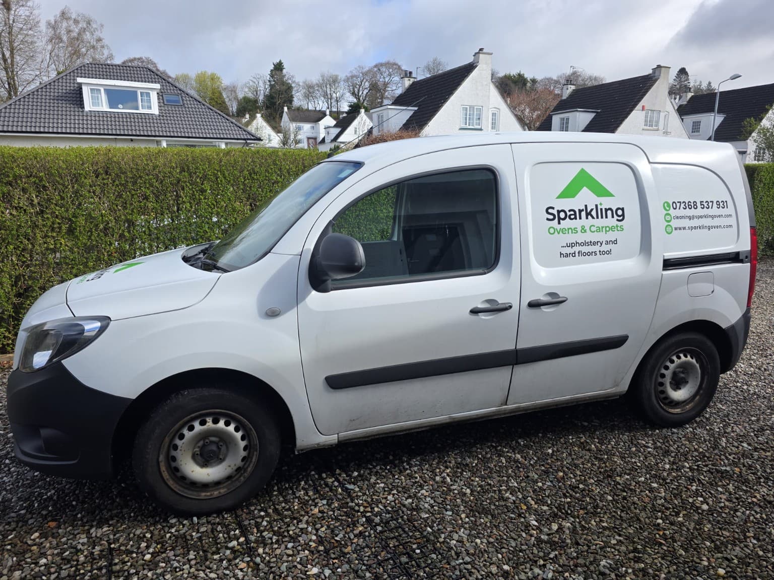 Sparkling Ovens and Carpets branded service van